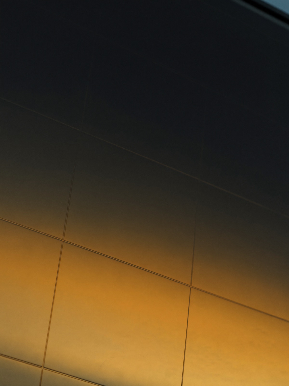 Macro detail of a solar panel catching golden light